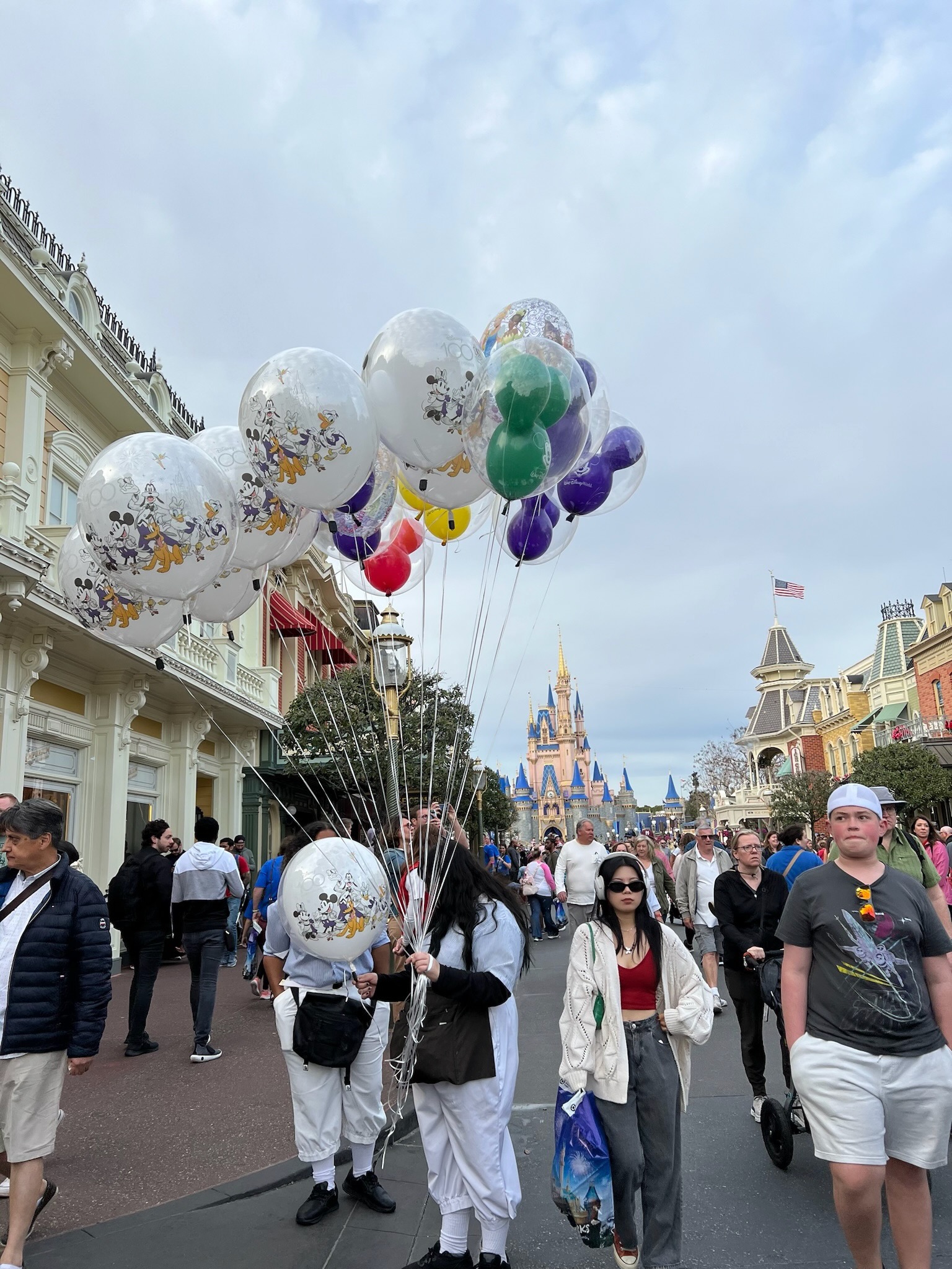 Main Street USA with colorful balloons and Cinderella Castle