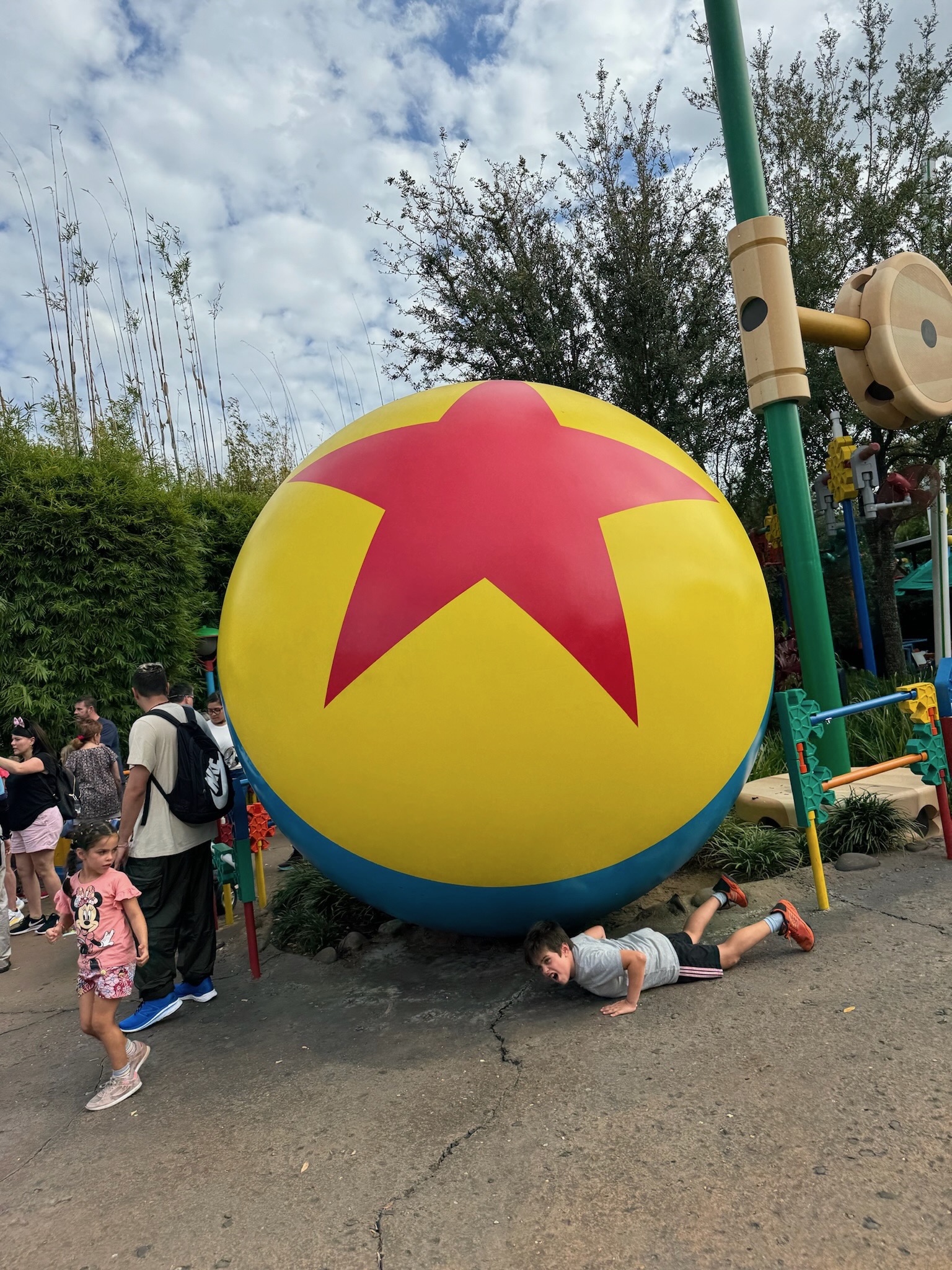 Kelly at EPCOT's Festival of Arts with Spaceship Earth in the background